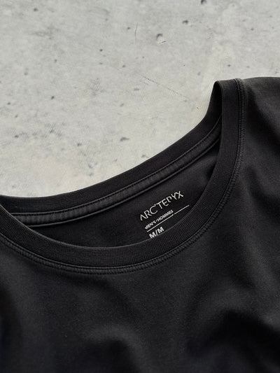 Arc'teryx front pocket spell out T shirt